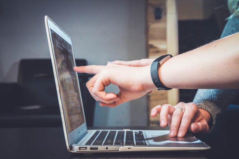 Person using a laptop representing web accessibility and WCAG compliance